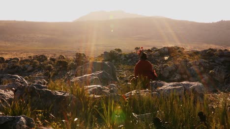 Tribal-man-walking-in-countryside-4k