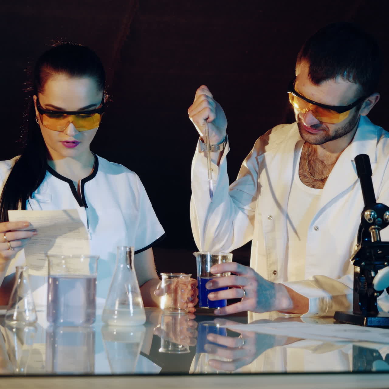 Scientists are experimenting with measuring pH in a chemical laboratory. Medical scientific equipment Square video