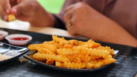 Detail-shot-of-french-fries-on-table