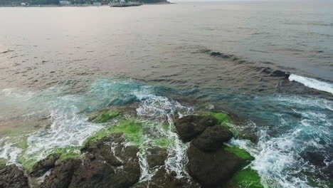 waves breaking into the rocks