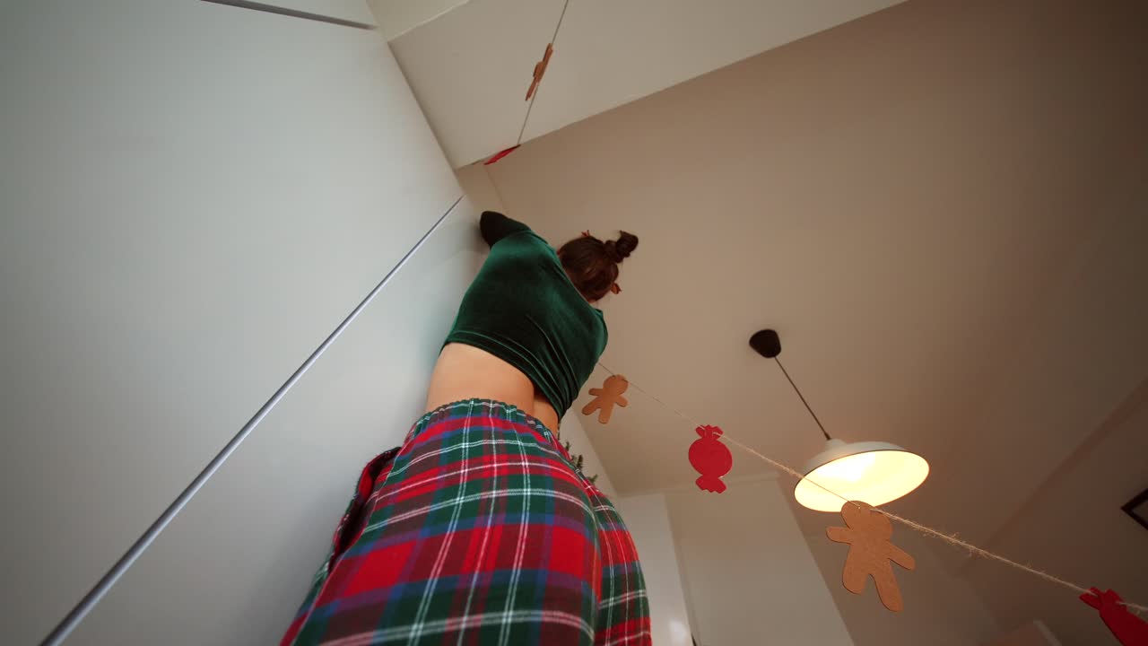 Woman decorating home for Christmas