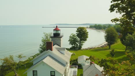 Drone-shot-passing-of-the-historic-light-houses-at-Sodus-point-New-York-vacation-spot-at-the-tip-of-land-on-the-banks-of-Lake-Ontario