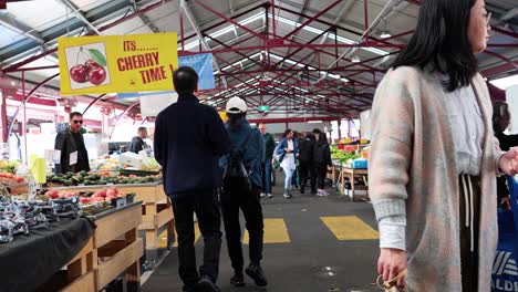 people browsing stalls at a busy market