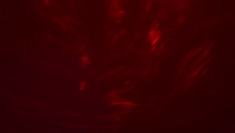 fondo abstracto rojo. humo retorcido, formas fluidas aleatorias