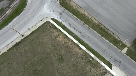 drone descends over abandoned industrial park