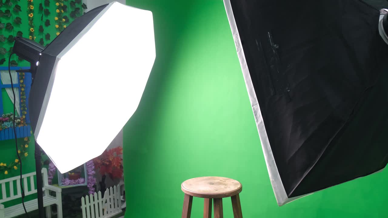 estudio de fotos o video con dos luces de estudio hexagonal. pantalla verde y silla fija