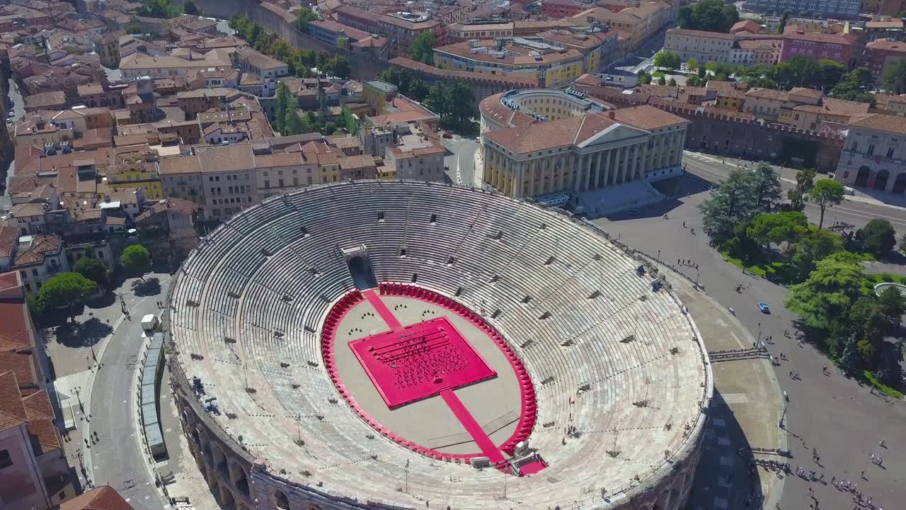 Aerial panoramic view of Arena di Verona, Italy. The drone hovers over the Arena, the City Hall and Bra Square are visible. A view of the Arena and the city opens. 4k vieo.