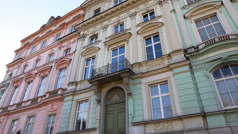 row of historic pastel-colored buildings with ornate architecture