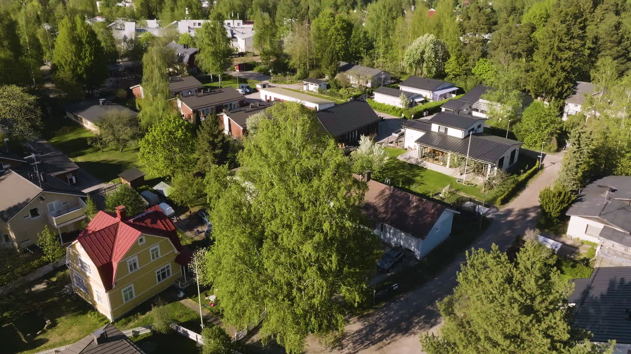 Drone revealing a solar powered house in a finnish neighborhood, summer evening
