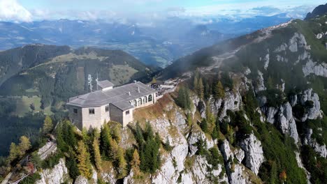 soaring peak pierces azure sky, casting long shadow on lush valley below