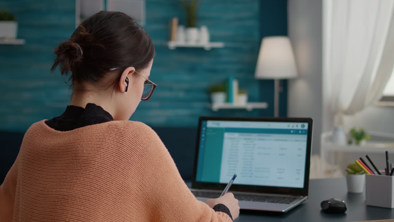 Student working form home on laptop to do internet research