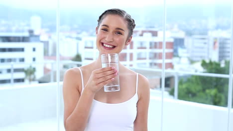 happy young woman drinking water