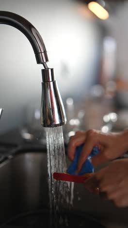 washing dishes in a kitchen sink