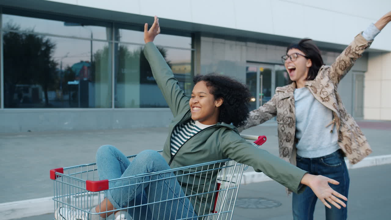 Two Women Having Fun with a Shopping Cart