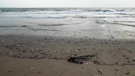 plastic trash on the beach, polluted ocean