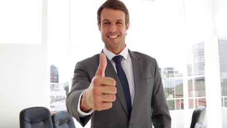 happy businessman giving thumbs up