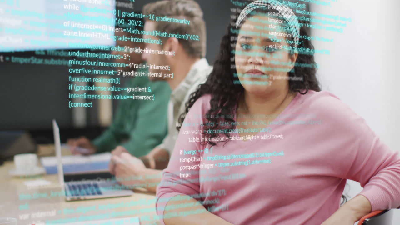 Animation of computer language over biracial female discussing with coworkers in office