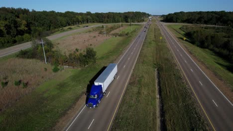 Aerial-of-Semi-Truck-Driving-Down-Highway-in-United-States