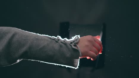 young woman, teenager, plays with the light moving her hand delicately, creating beautiful reflections of light