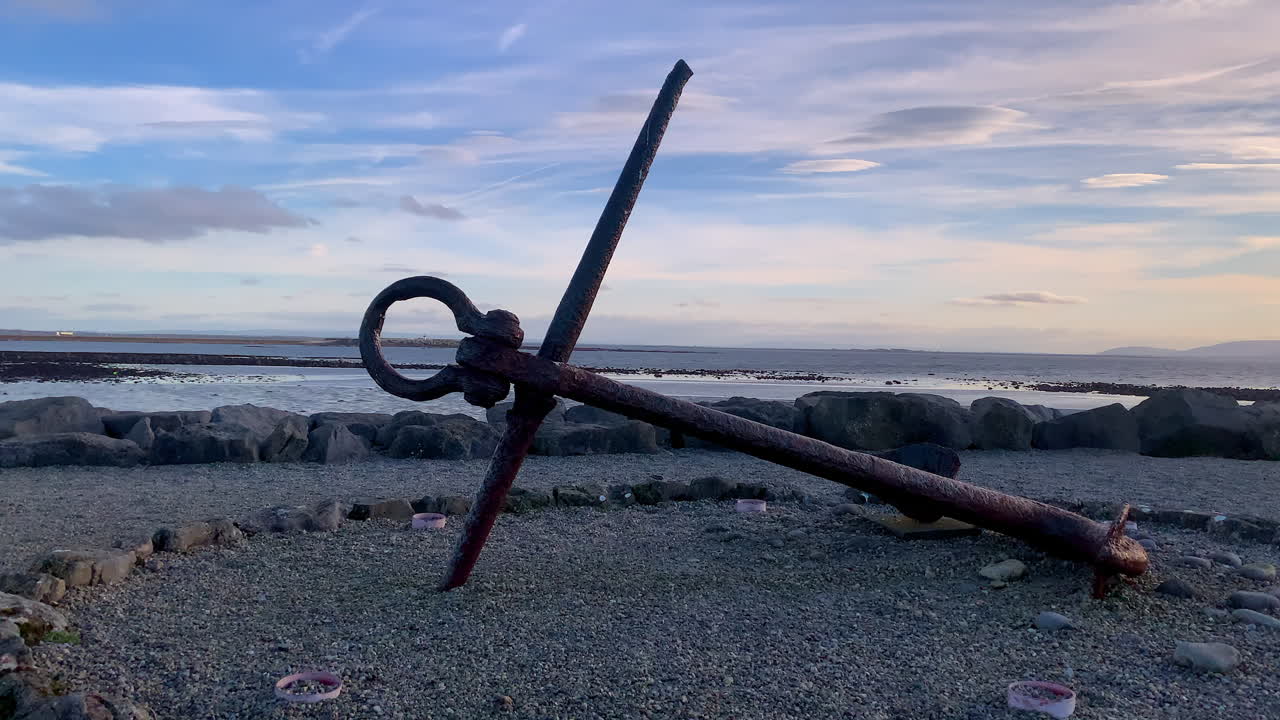 Anchor monument on Salthill promenade with Galway Bay in the background, capturing a scenic coastal view