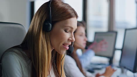 helpful woman working contact center closeup. smiling assistant talking headset