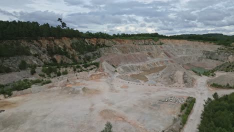 Smooth-upwarding-aerial-movement-towards-an-ordinary-industrial-quarry-in-France