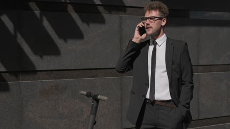 businessman talking on phone outside