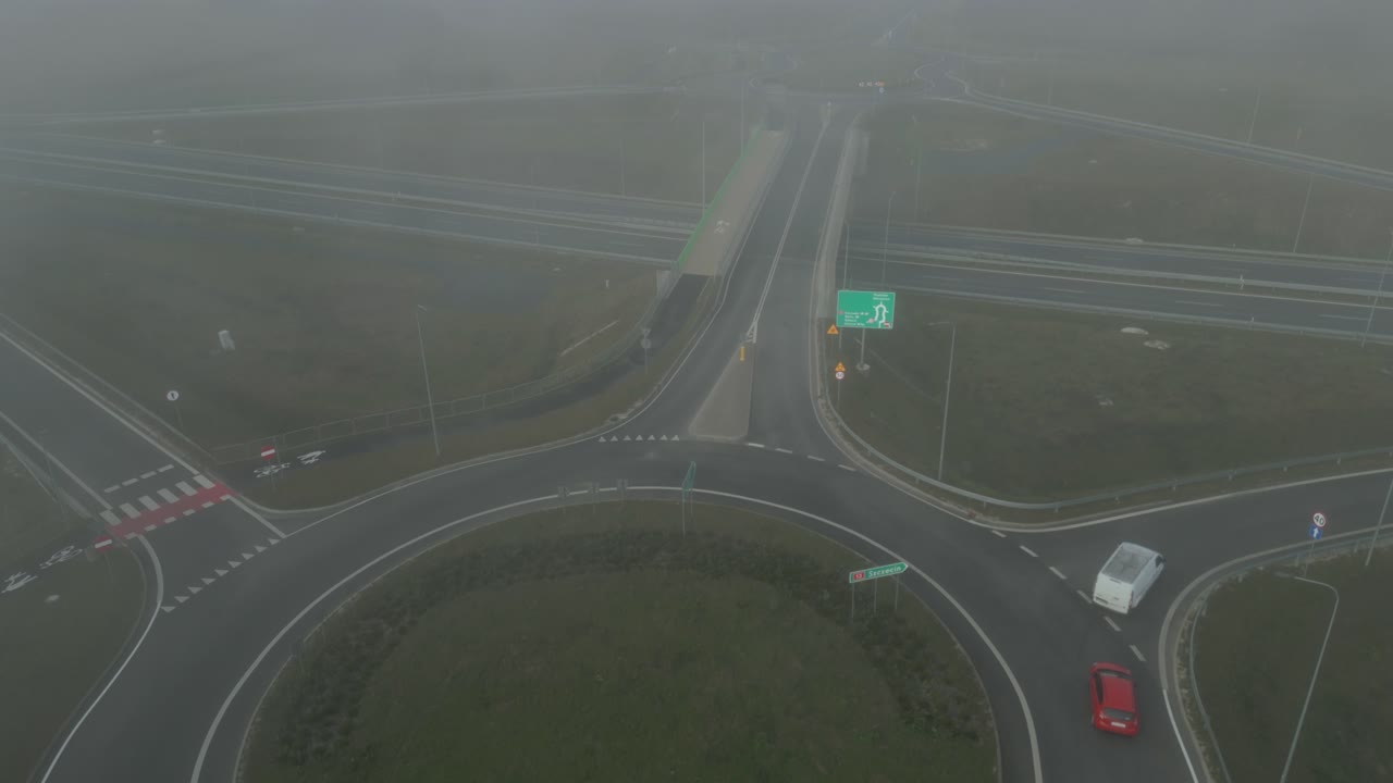 Aerial View of a Foggy Highway Intersection