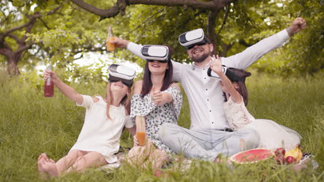 family enjoying a picnic with vr glasses