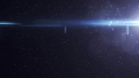 blue spot of light glowing in the night sky