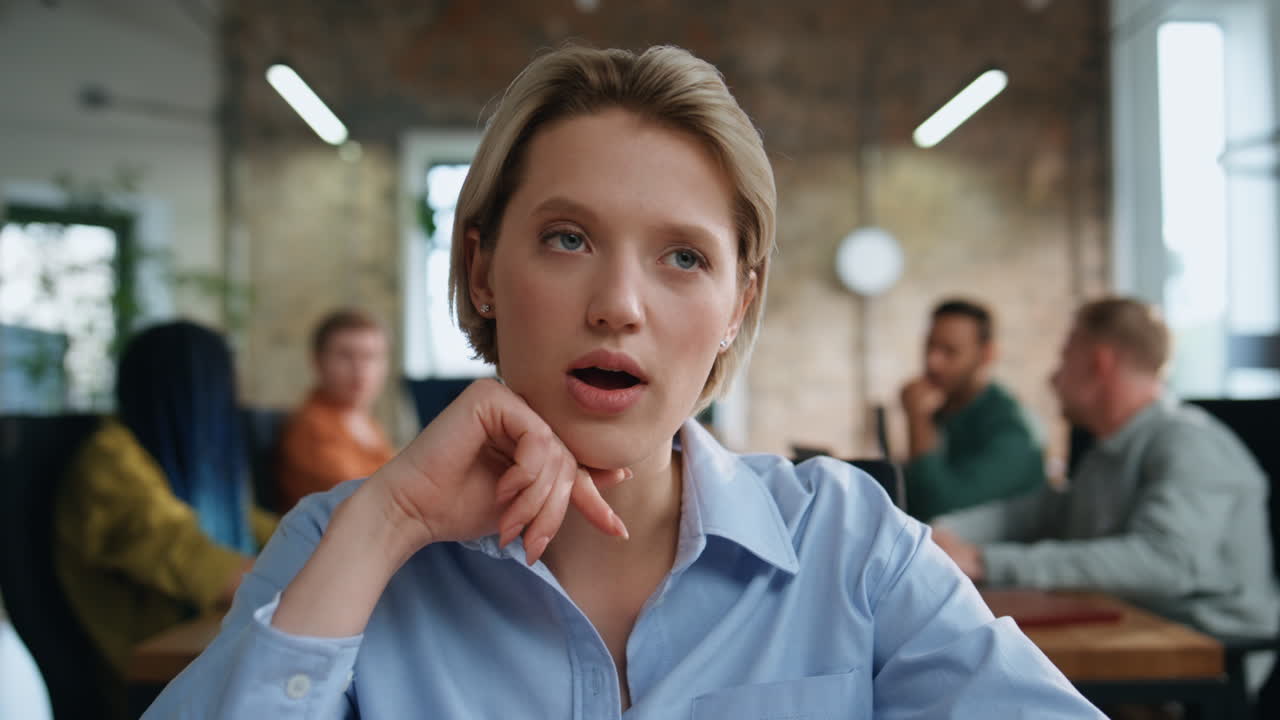 Lady discussing work online sitting coworking with team close up. Woman webinar