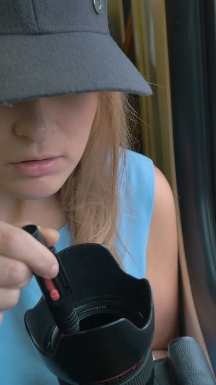 Woman with a camera on a train