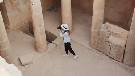 tourist taking pictures in an ancient tomb