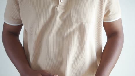 man wearing a beige polo shirt