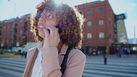 african-american businesswoman speaking on phone on the street