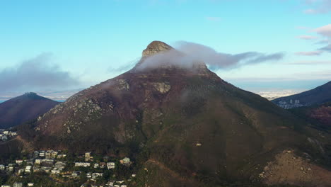 Rocky-peak-with-clouds-aerial-shot-sunset-South-Africa