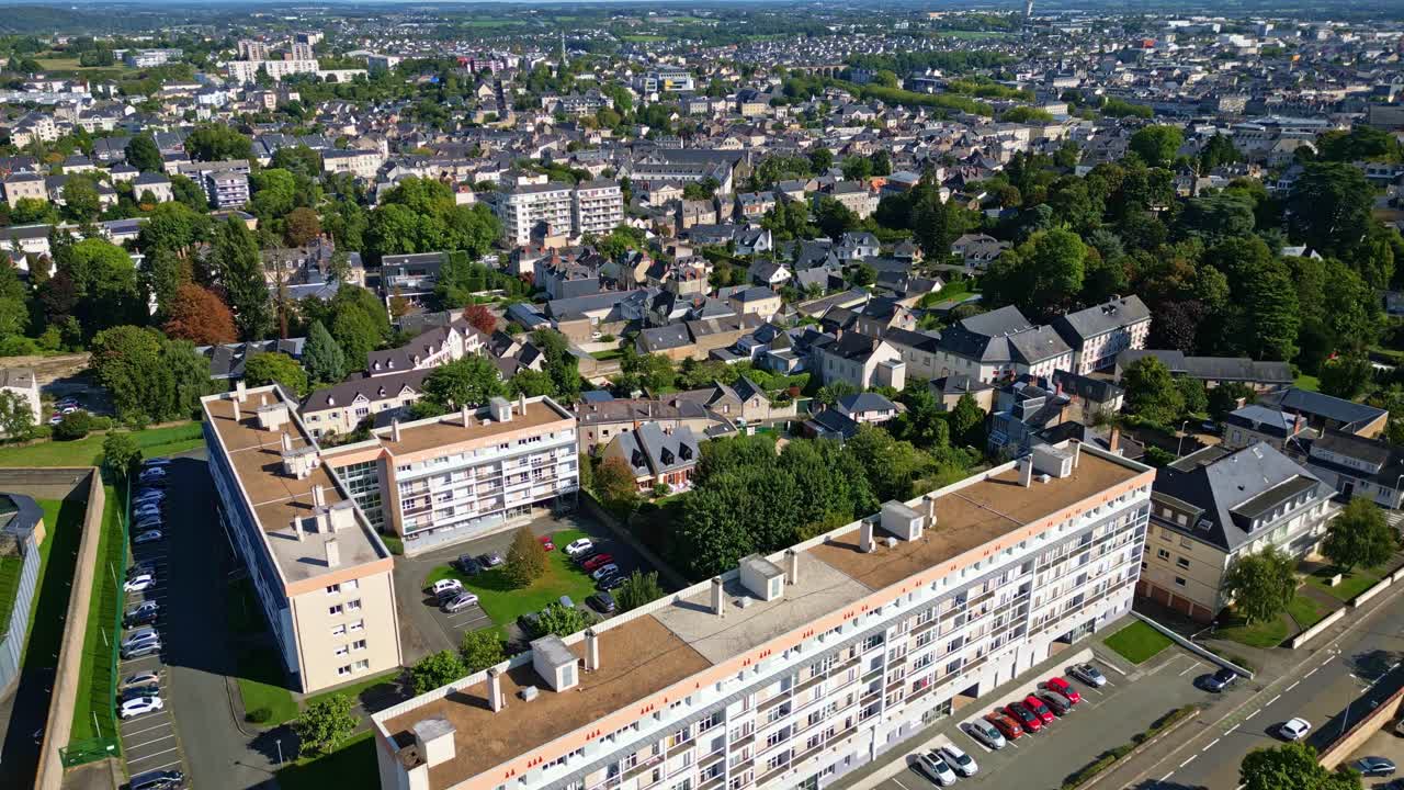 Aerial of Laval city showing residential area with streets rooftops, daytime establishing over roadway