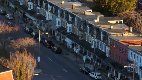 tight aerial angled zoom of row houses in american city