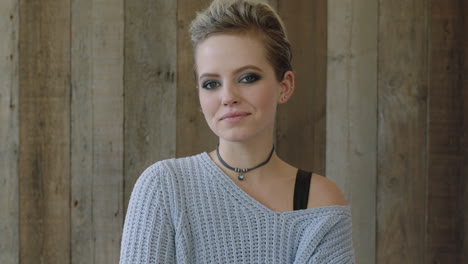 close up portrait of cute young woman looking pensive contemplative turns head smiling confident at camera stylish independent female