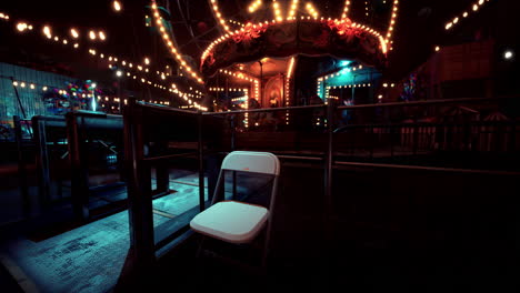 lonely chair at an abandoned amusement park during nighttime festivities