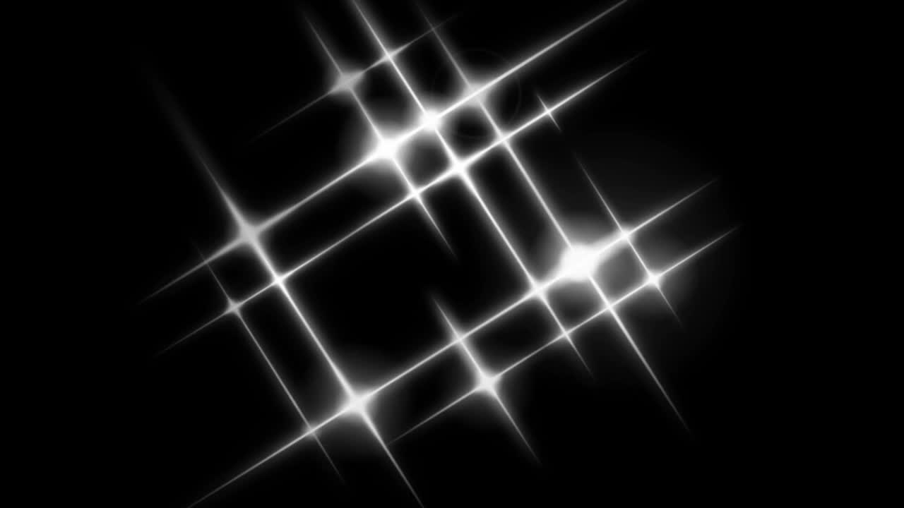 Animation white light sparkles on black background.