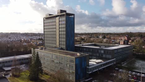 aerial view pilkington's glass head office, a modern blue high-rise with shared office space and townscape orbit