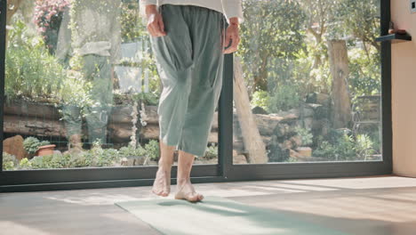 man doing yoga stretches at home