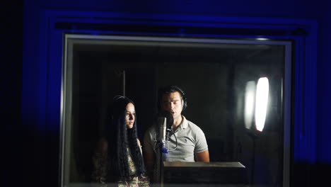 couple singing in recording studio