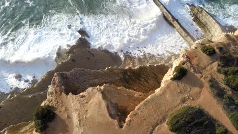 aerial fly up over the cliff and waves, sesimbra