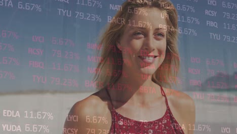 animation of financial data processing over woman on beach