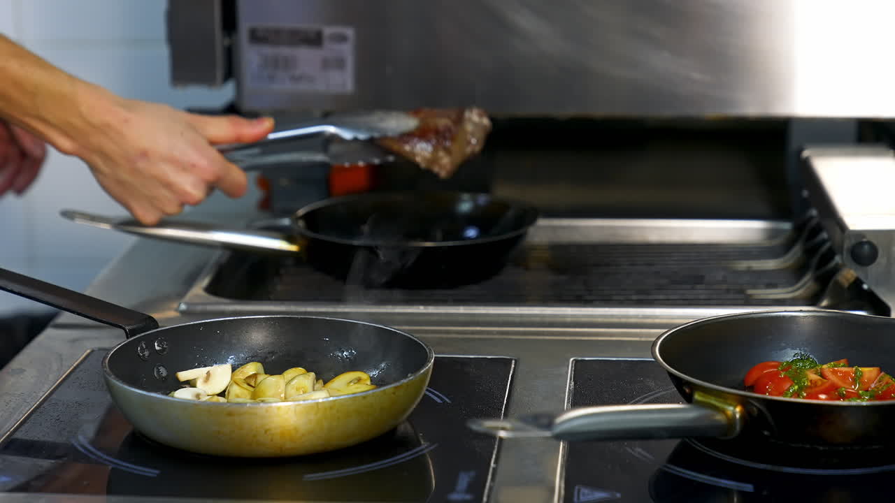 Chef preparing food with pan. Professional chef cooking food at restaurant