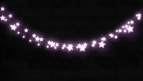 animation of purple star shaped glowing fairy lights hanging against copy space on black background