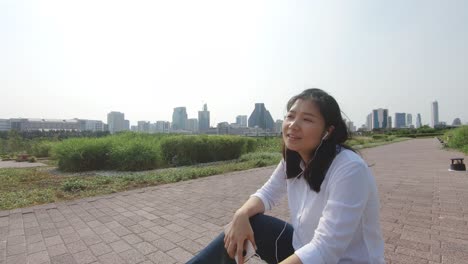 an asian woman in public park.