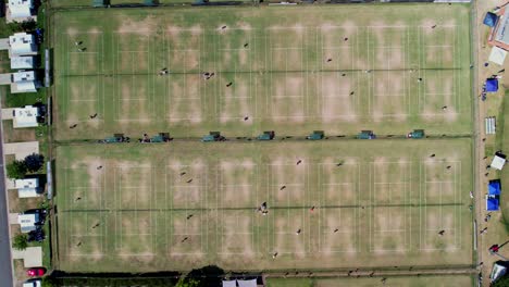 Yarrawonga,-Victoria,-Australia---17-February-2023:-Straight-down-view-of-players-on-lawn-tennis-courts-at-Yarrawonga-tournament